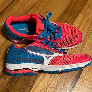 Pink and blue mizuno sneakers.